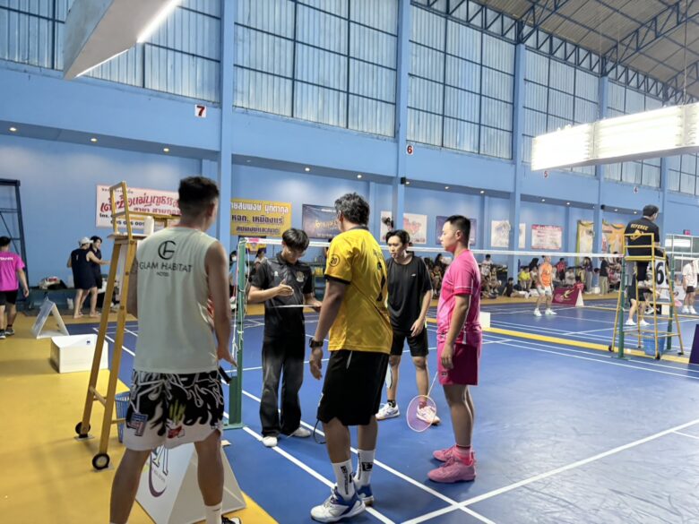 Glam Habitat's courtside signage during a match at the Phuket HR Patong Open 2026 badminton tournament
