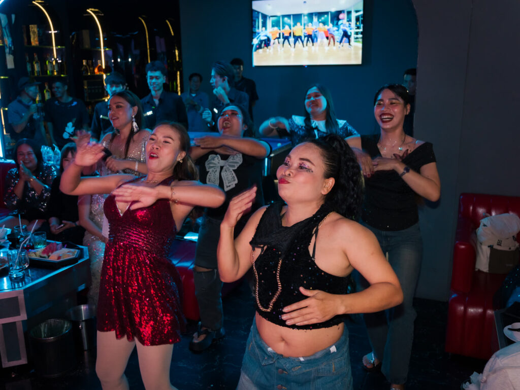 Glam Habitat staff and guests dancing together at the staff party
