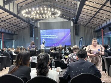 Speaker presenting on Thailand tourism amidst geopolitical conflicts at the PTA AGM 2026
