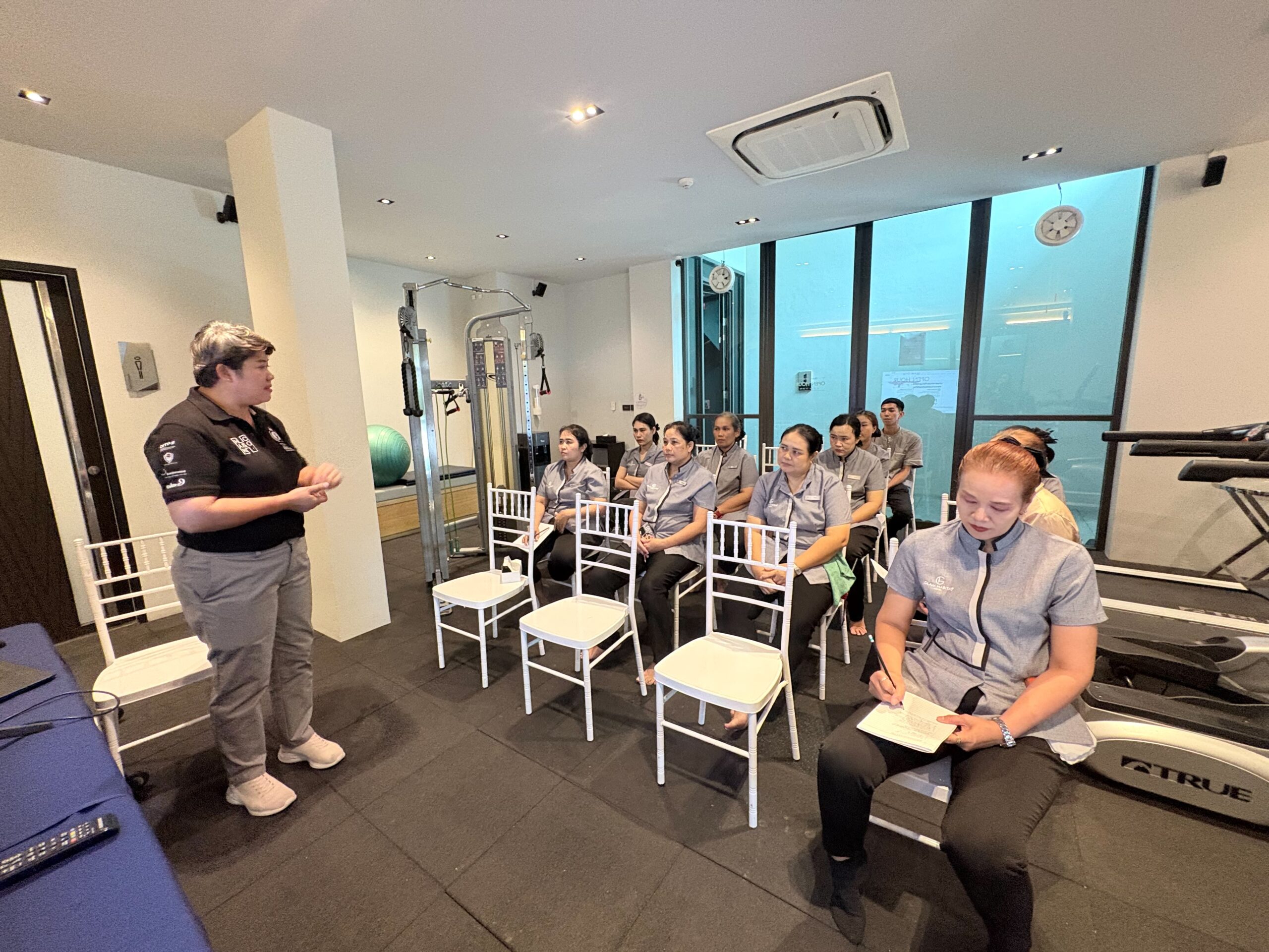 Housekeeping staff seated in rows during a classroom training session at Glam Habitat