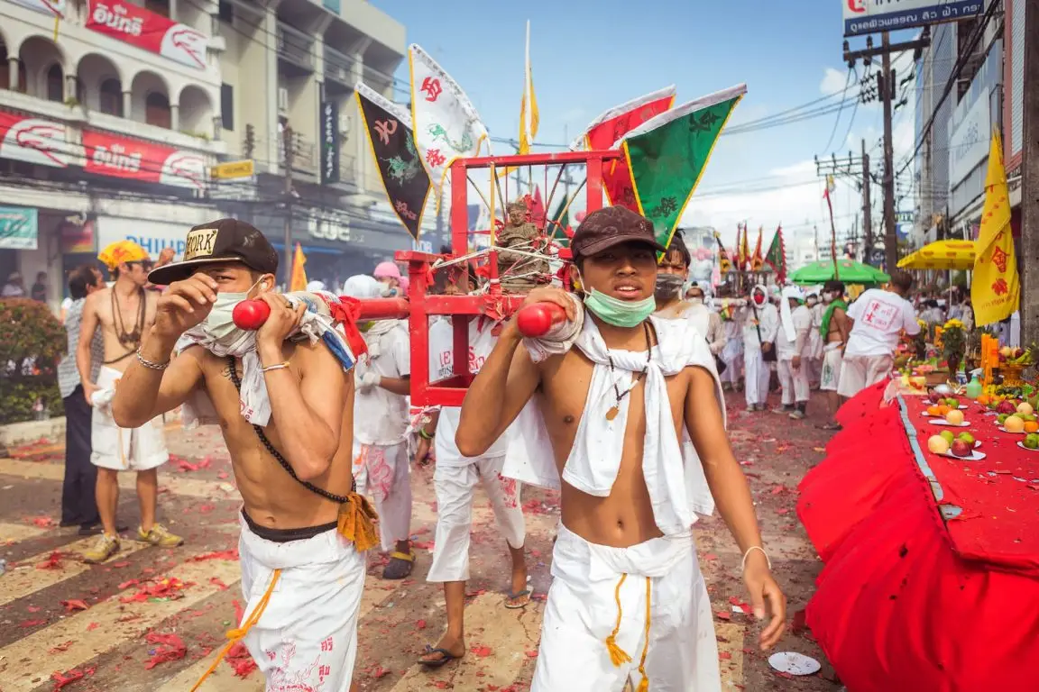 Devotees and lanterns during a Phuket Vegetarian Festival procession
