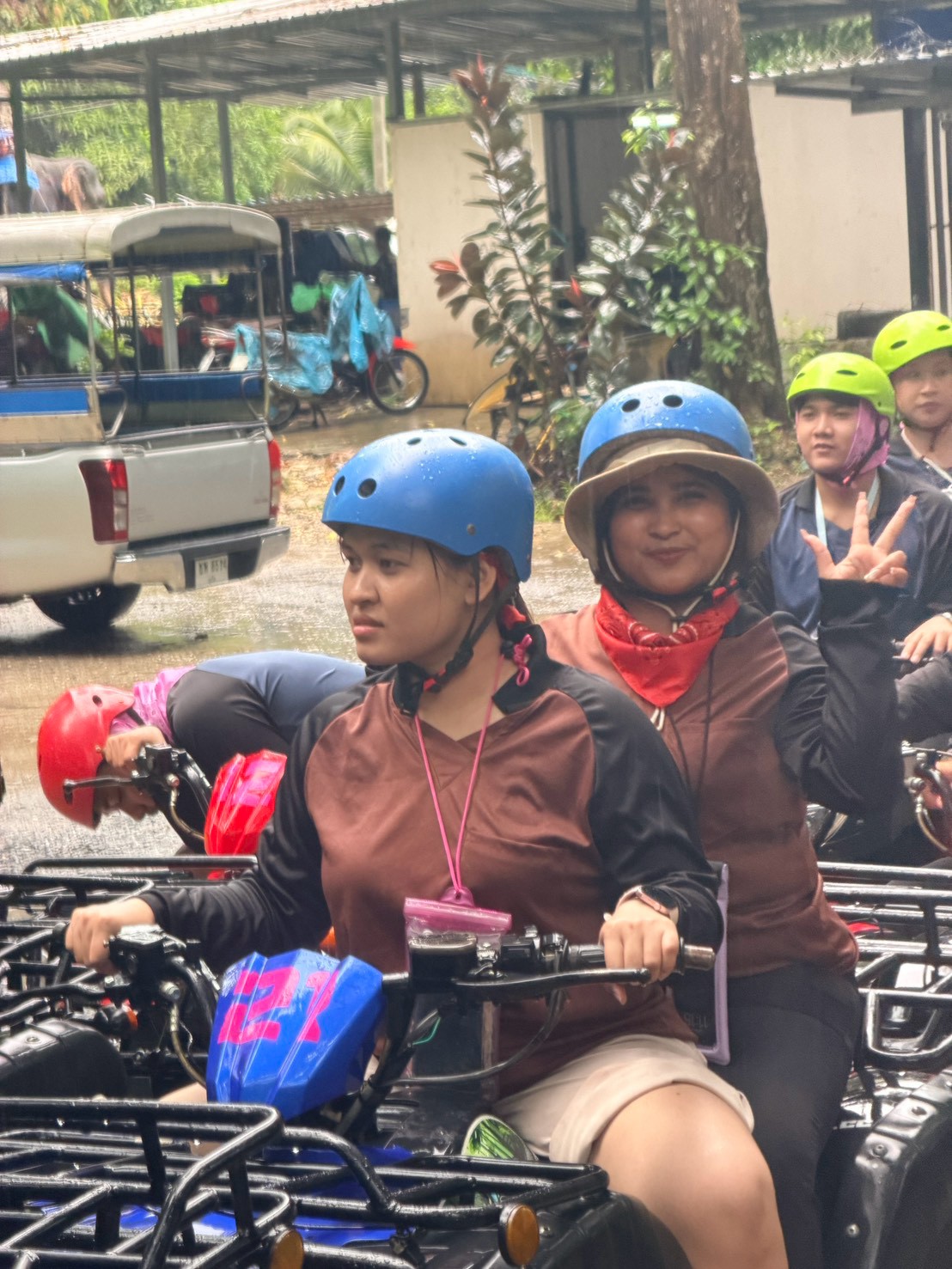 Glam Habitat staff riding an ATV together on the trail during Outing 2026
