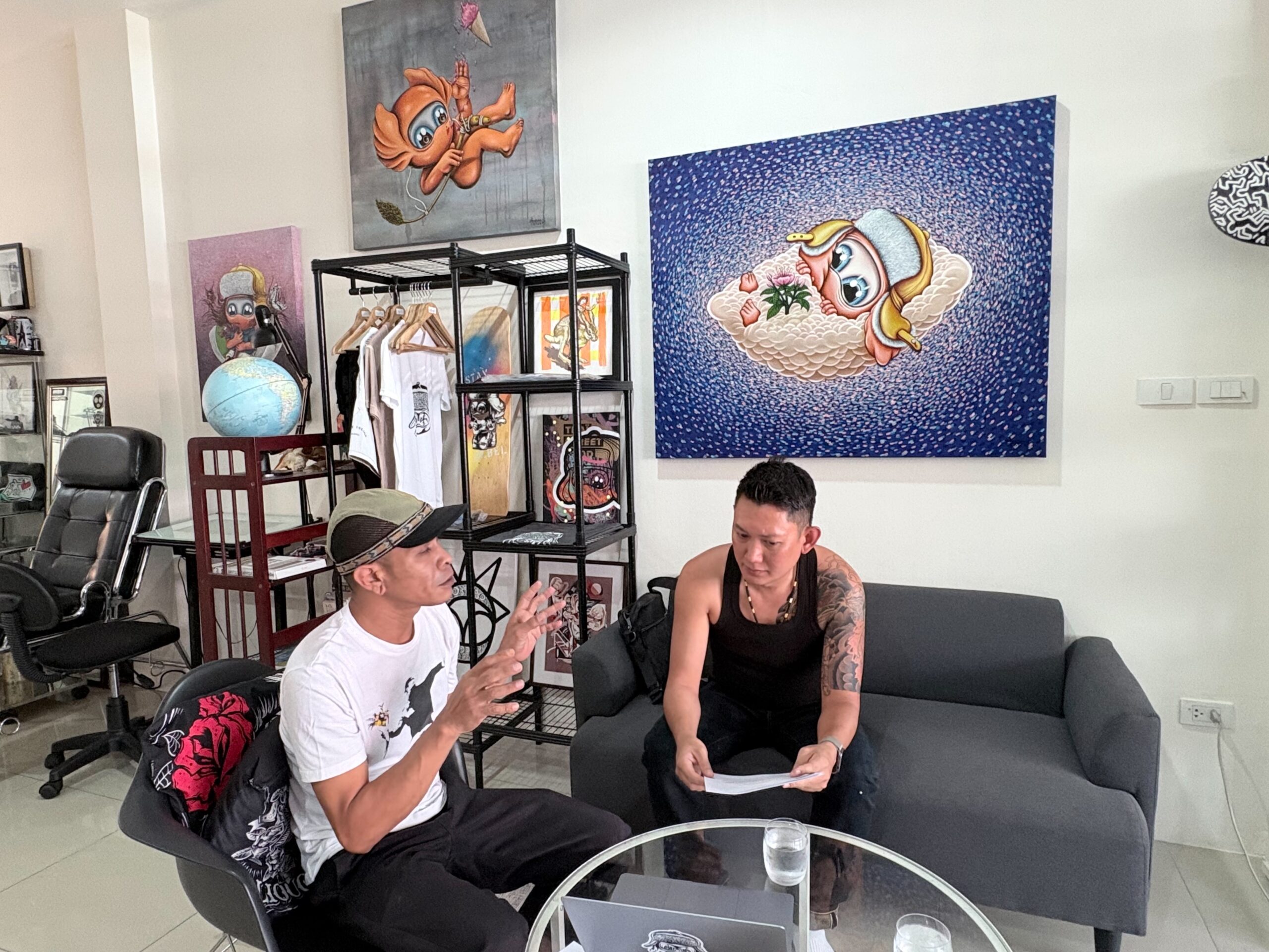 Glam Habitat team meeting with artist Amann in his Phuket studio to discuss the MUTE exhibition