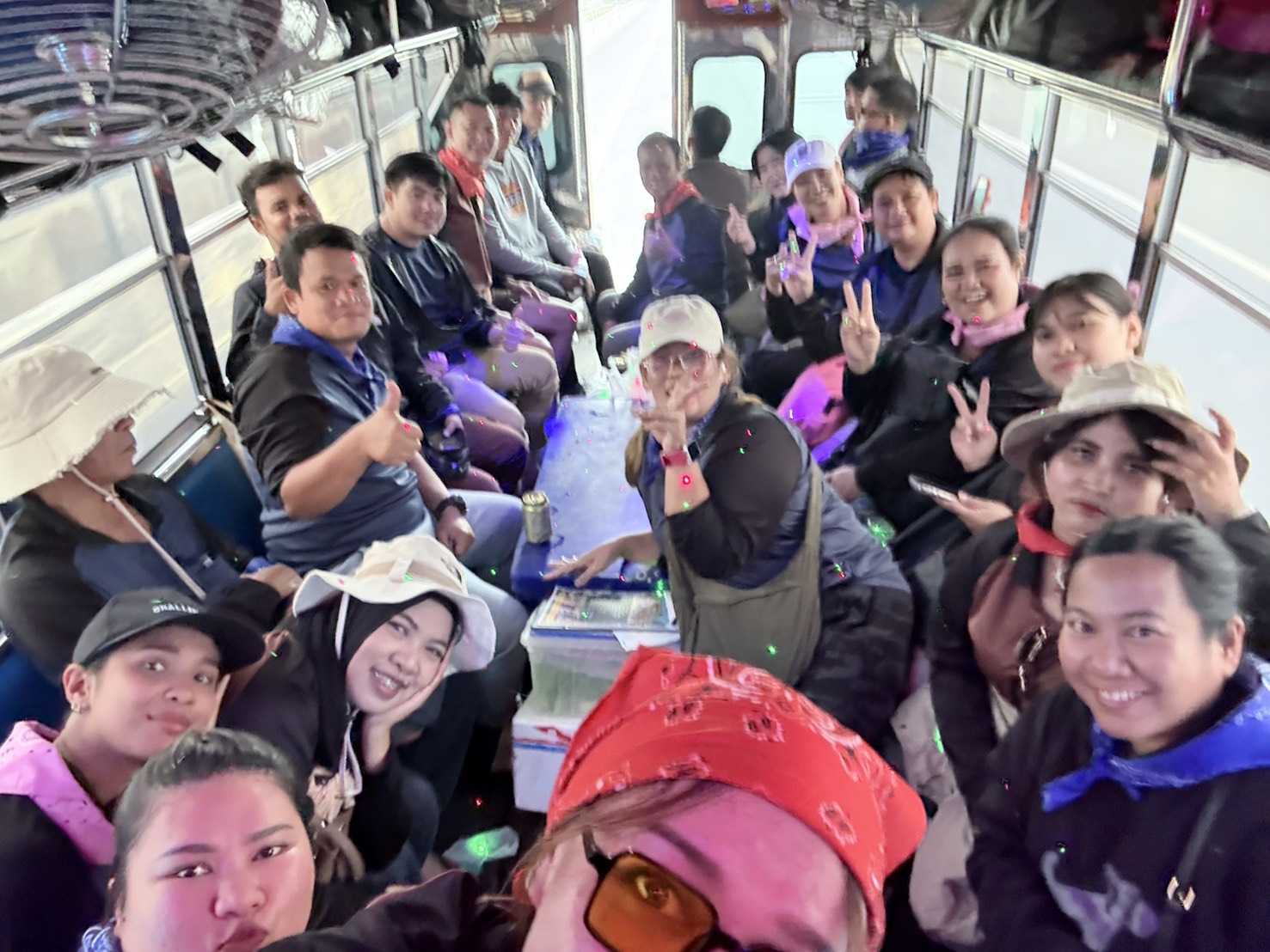 The Glam Habitat team taking a group selfie inside the decorated party truck used to shuttle between activities during Outing 2026