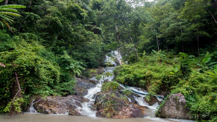 Bang Wan Waterfall surrounded by lush tropical greenery near Kamala