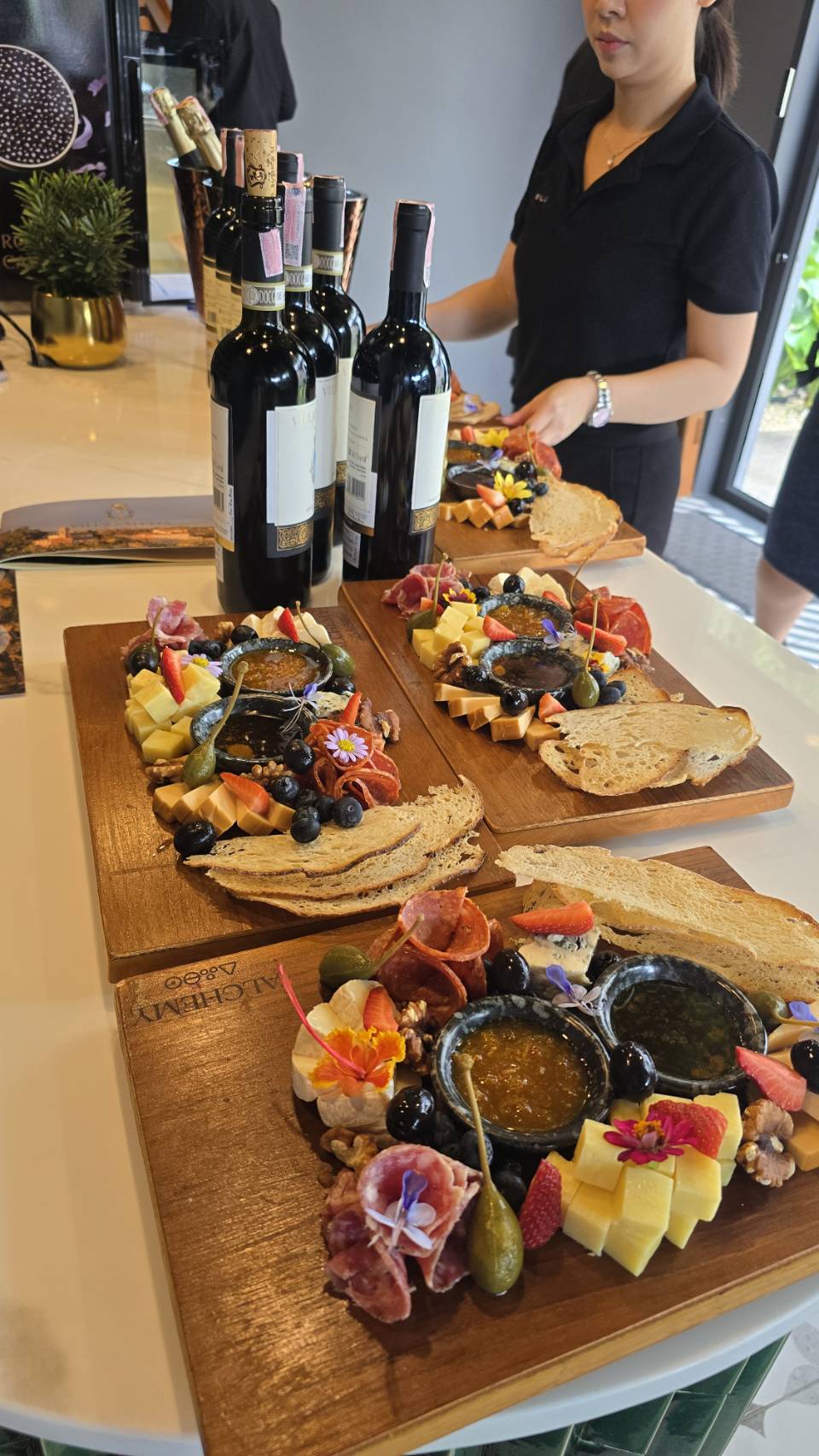 Charcuterie boards with cured meats, cheeses, olives, honey and toasted bread served with the Villa Saletta wines