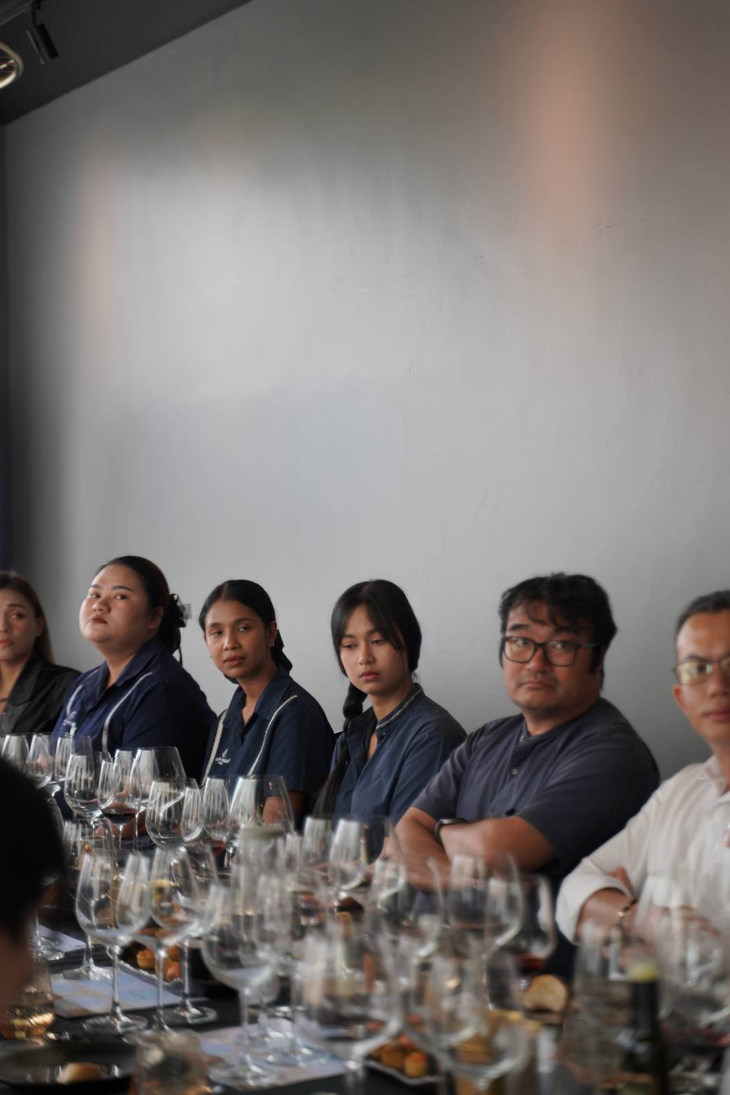Glam Habitat team members listening at the Villa Saletta wine masterclass in Phuket