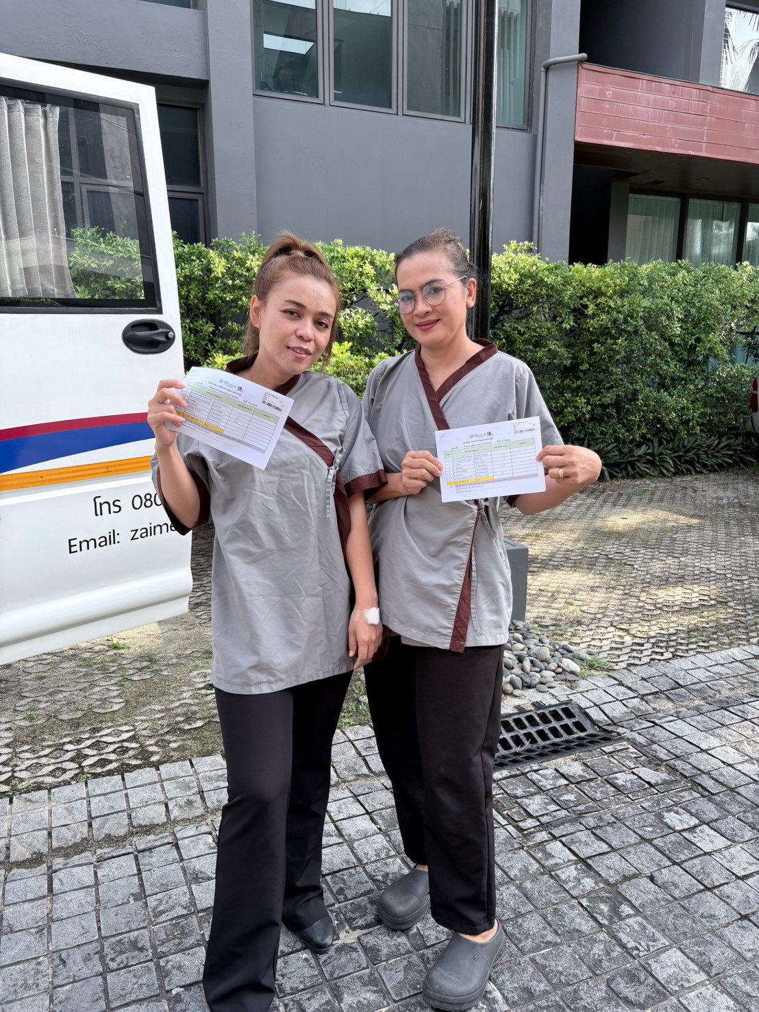 Two Glam Habitat team members smiling after completing their annual health check