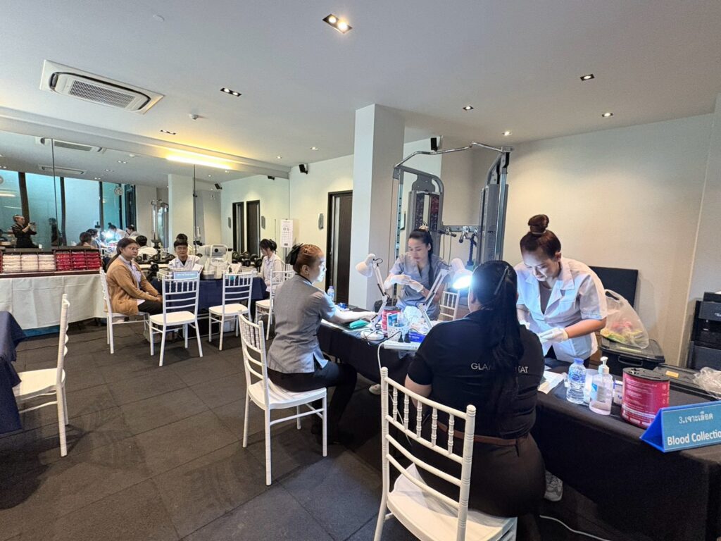 Glam Habitat team members at the blood collection tables set up by the Phuket International Hospital medical team inside the hotel
