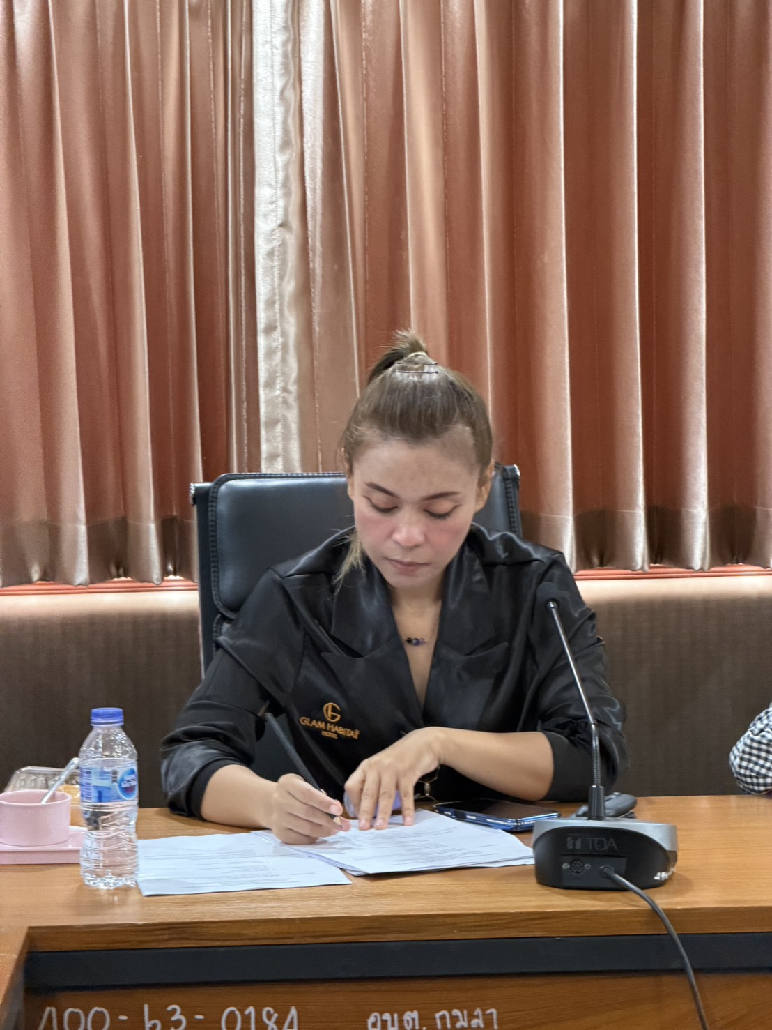 Glam Habitat Hotel's representative taking notes during the Kamala SAO Loy Krathong planning meeting
